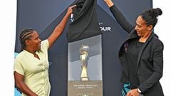 Former Brazilian national women's team football player Aline Pellegrino (R) and Brazilian midfielder Miraildes Maciel Mota (L) uncover the FIFA Women's World Cup trophy