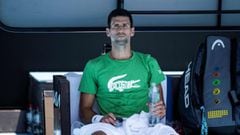 TOPSHOT - Novak Djokovic of Serbia takes part in a practice session ahead of the Australian Open tennis tournament in Melbourne on January 13, 2022. (Photo by Mike FREY / AFP) / -- IMAGE RESTRICTED TO EDITORIAL USE - STRICTLY NO COMMERCIAL USE --