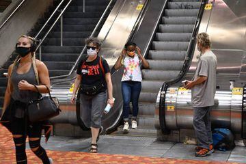 Free masks were given to travellers who didn't have one with them at the Lionel Groulx station on July 13, 2020 as face coverings and masks become compulsory in all public transports in the Quebec province in Montreal, Quebec. - Directeur du bureau