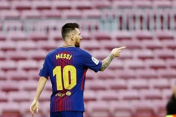 Messi celebrates scoring, in an empty Camp Nou