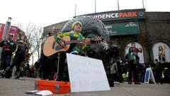 Nov 22, 2015; Portland, OR, USA; Finn Jacobs of Vancouver, WA plays the guitar in front of Providence Park to raise money to travel and train for Ajax Amsterdam FC before leg one of the Western Conference championship between Portland Timbers and FC Dalla