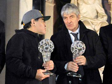 Diego Maradona and Paolo Rossi pose for a photo as they attend the Italian football hall of fame awards ceremony in Florence, Italy, January 17, 2017.