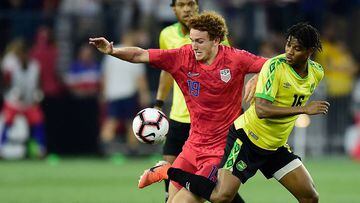 (FILES) In this file photo taken on June 5, 2019, Josh Sargent (19) of the US and Peter Vassell (16) of Jamaica battle for the ball in the second half during an International Friendly at Audi Field on June 5, 2019 in Washington, DC. - US coach Gregg Berhalter unveiled his 23-man squad fror the CONCACAF Gold Cup on June 6, 2019, leaning heavily on established veterans for what will be the first major tournament of his tenure. A day after an experimental line-up slumped to a lacklustre 1-0 loss against Jamaica, Berhalter hopes experience will help his team successfully defend their continental crown. Sargent, who squandered two good chances in Wednesday&#039;s defeat to Jamaica, was a notable omission from the 23. (Photo by Patrick McDermott / GETTY IMAGES NORTH AMERICA / AFP)