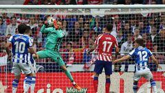 Real Sociedad's Spanish goalkeeper Alex Remiro (3R) jumps to make a save during the Spanish league football match between Club Atletico de Madrid and Real Sociedad at the Wanda Metropolitano stadium in Madrid on May 28, 2023. (Photo by Pierre-Philippe MARCOU / AFP)