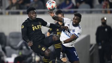 Nov 2, 2021; Los Angeles, California, USA;  Vancouver Whitecaps forward Cristian Dajome (11) and Los Angeles FC defender Jesus Murillo (94) jump to head the ball in the second half at Banc of California Stadium. Mandatory Credit: Jayne Kamin-Oncea-USA TOD
