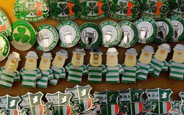 A picture shows pin badges on a stall outside Celtic Park in Glasgow on December 17, 2016 before the Scottish Premiership football
