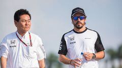 Honda chief Yasuhisa Arai with Fernando Alonso of McLaren at the Malaysian Grand Prix.