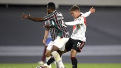 BUENOS AIRES, ARGENTINA - MAY 25: Federico Girotti of River Plate kicks the ball against  Luccas Claro of Fluminense to score the first goal of his team during a group D match of Copa CONMEBOL Libertadores 2021 between River Plate and Fluminense at Estadio Monumental Antonio Vespucio Liberti on May 25, 2021 in Buenos Aires, Argentina. (Photo by Juan Mabromata-Pool/Getty Images)