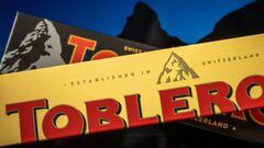 A picture taken on March 6, 2023, shows packagings of Toblerone chocolate bars owned by US firm Mondelez with a representation of the Matterhorn mountain (back) and of a generic mountain (front) in Geneva. - Toblerone is to remove the Swiss iconic Matterhorn peak from its packaging when some of the chocolate's production is moved from Switzerland to Slovakia and replaced by a more generic mountain under strict "Swissness" rules. (Photo by Fabrice COFFRINI / AFP) (Photo by FABRICE COFFRINI/AFP via Getty Images)