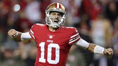 SANTA CLARA, CALIFORNIA - NOVEMBER 13: Jimmy Garoppolo #10 of the San Francisco 49ers celebrates after a touchdown by Christian McCaffrey #23 during the fourth quarter against the Los Angeles Chargers at Levi's Stadium on November 13, 2022 in Santa Clara, California.   Ezra Shaw/Getty Images/AFP