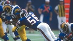 EAST RUTHERFORD, NJ - SEPTEMBER 8:  Lawrence Taylor #56 of the New York Giants tackles Robert Delpino #39 of the Los Angeles Rams during an NFL football game September 8, 1991 at The Meadowlands in East Rutherford, New Jersey. Taylor played for the Giants from 1981-93. (Photo by Focus on Sport/Getty Images) 