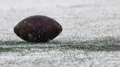 FOXBOROUGH, MASSACHUSETTS - JANUARY 07: A football is seen in the snow during a game between the New York Jets and New England Patriots at Gillette Stadium on January 07, 2024 in Foxborough, Massachusetts.   Winslow Townson/Getty Images/AFP (Photo by Winslow Townson / GETTY IMAGES NORTH AMERICA / Getty Images via AFP)