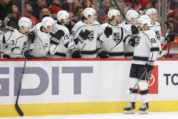Dec 19, 2021; Washington, District of Columbia, USA; Los Angeles Kings defenseman Christian Wolanin (86) celebrates with teammates after scoring a goal against the Washington Capitals during the third period at Capital One Arena. Mandatory Credit: Geoff B