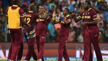 West Indies players celebrate after the wicket of India&#039;s Ajinkya Rahane during the World T20 cricket tournament semi-final match against India.