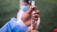 A nurse prepares a dose of the vaccine developed by Sinopharm of China against COVID-19 during a health workers vaccination campaign amid the novel coronavirus pandemic, in Ate, a district in Lima, on February 19, 2021. (Photo by Ernesto BENAVIDES / AFP)