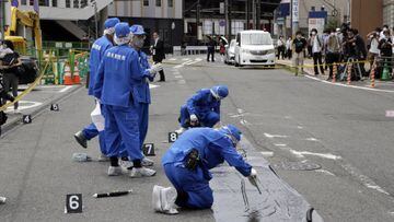 Police officers at the scene where Former Japanese Prime Minister Shinzo Abe was shot during a political event in Nara, Japan, on Friday, July 8, 2022. Abe was unresponsive after being shot during a political event on Friday, shocking a nation where gun violence is rare.  Photographer: Kosuke Okahara/Bloomberg via Getty Images