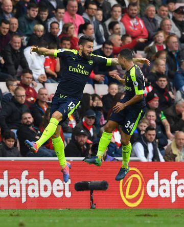 Olivier Giroud and Francis Coquelin jumping for joy after the Frenchman came off the bench to trigger the win.