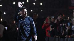 Argentine football player Lionel Messi greets fans during his entrance to the field before the start of Maximiliano Rodriguez's farewell match at the Marcelo Bielsa stadium in Rosario, Argentina on January 24, 2023. (Photo by STRINGER / AFP)