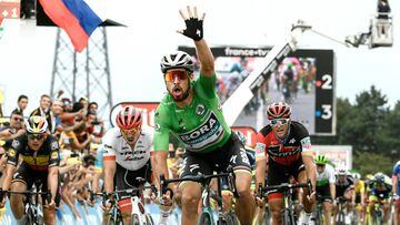 Slovakia&#039;s Peter Sagan (C), wearing the best sprinter&#039;s green jersey, celebrates as he crosses the finish line to win the 13th stage of the 105th edition of the Tour de France cycling race, between Le Bourg-d&#039;Oisans and Valence, on July 20,
