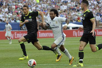 Real Madrid defender Marcelo (12) drives to the goal against Chelsea's #21 Nemanja Matic (L) in the International Champions Cup on Saturday