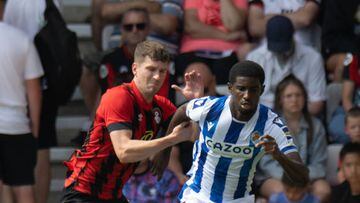 BOURNEMOUTH, ENGLAND - JULY 30: Bournemouth's Chris Mepham (left) battles with Real Sociedad's Mohamed-Ali Cho (right)  during the Football Friendly match between Bournemouth and Real Sociedad at Vitality Stadium on July 30, 2022 in Bournemouth, England. (Photo by David Horton - CameraSport via Getty Images)