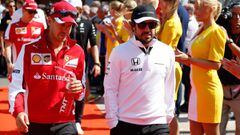 SPA, BELGIUM - AUGUST 23: Sebastian Vettel of Germany and Ferrari and Fernando Alonso of Spain and McLaren Honda arrive for the drivers' parade before the Formula One Grand Prix of Belgium at Circuit de Spa-Francorchamps on August 23, 2015 in Spa, Belgium. (Photo by Charles Coates/Getty Images)  PUBLICADA 15/06/16 NA MA36 3COL