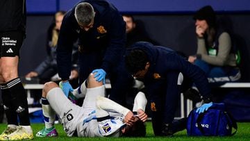 Real Sociedad's Spanish forward #07 Ander Barrenetxea receives medical attention during the Spanish league football match between CA Osasuna and Real Sociedad at El Sadar stadium in Pamplona on December 2, 2023. (Photo by ANDER GILLENEA / AFP)