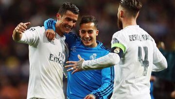 Cristiano of Real Madrid celebrates with team mates Lucas Vazquez and Sergio Ramos after the UEFA Champions league Quarter Final Second Leg match between Real Madrid and VfL Wolfsburg.