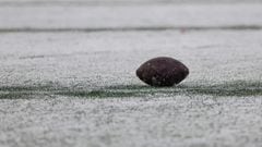 FOXBOROUGH, MASSACHUSETTS - JANUARY 07: A football is seen in the snow during a game between the New York Jets and New England Patriots at Gillette Stadium on January 07, 2024 in Foxborough, Massachusetts.   Winslow Townson/Getty Images/AFP (Photo by Winslow Townson / GETTY IMAGES NORTH AMERICA / Getty Images via AFP)