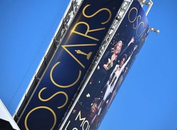 A sign announcing the upcoming Oscars Award show towers over Hollywood Boulevard, March 18, 2022, in Hollywood, California.