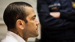 (FILES) Brazilian footballer Dani Alves looks on at the start of his trial at the High Court of Justice of Catalonia in Barcelona, on February 5, 2024. Ex-Brazil star Dani Alves has been sentenced to 4.5 years in jail for rape, Barcelona's court announced on February 22, 2024. (Photo by Jordi BORRAS / POOL / AFP)