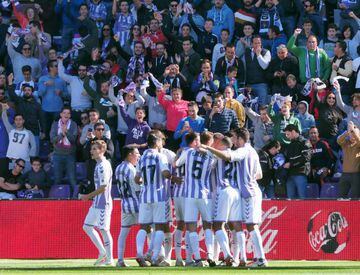 Valladolid players celebrate scoring against Huesca.