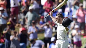 Brendon McCullum captain of New Zealand lifts his bat and helmet to the fans as he walks from the field for the last time.