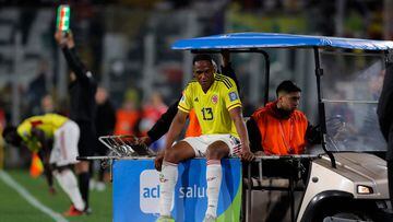 Colombia's defender Yerry Mina leaves the pitch in a medical car after being injured during the 2026 FIFA World Cup South American qualifiers football match between Chile and Colombia, at the David Arellano Monumental stadium, in Santiago, on September 12, 2023. (Photo by Javier TORRES / AFP)