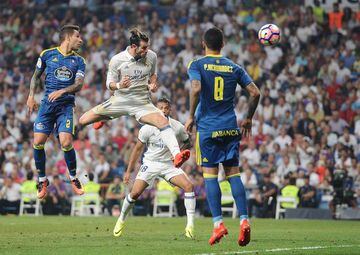 Gareth Bale of Real Madrid heads the ball past Pablo Hernandez of Celta de Vigo during the La Liga match between Real Madrid CF and RC Celta de Vigo