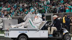 Nov 24, 2023; East Rutherford, New Jersey, USA; Miami Dolphins linebacker Jaelan Phillips (15) is driven off the field after an apparent injury during the second half against the New York Jets at MetLife Stadium. Mandatory Credit: Vincent Carchietta-USA TODAY Sports