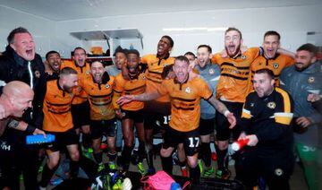 Newport County players celebrate after beating Middlesbrough
