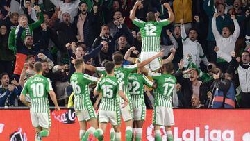 Real Betis&#039; Brazilian defender Sidnei (up) celebrates after scoring a goal during the Spanish league football match between Real Betis and Real Madrid CF at the Benito Villamarin stadium in Seville on March 8, 2020. 