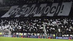 Juventus supporters cheer during the UEFA Champions League round of sixteen first leg football match between Juventus and Tottenham Hotspur