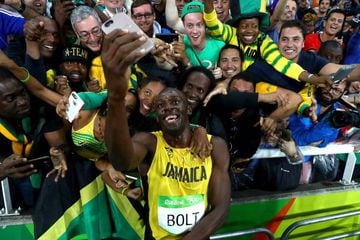 Usain Bolt of Jamaica celebrates with fans after winning the Men's 200m Final on Day 13 of the Rio 2016 Olympic Games at the Olympic Stadium