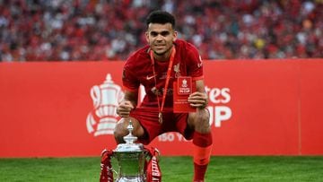 LONDON, ENGLAND - MAY 14: Luis Diaz of Liverpool celebrates with The Emirates FA Cup trophy after their sides victory during The FA Cup Final match between Chelsea and Liverpool at Wembley Stadium on May 14, 2022 in London, England. (Photo by Shaun Botterill/Getty Images)