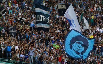 Napoli's fans celebrate at the end of the Italian Serie A football match SSC Napoli vs ACF Fiorentina on October 18, 2015 at the San Paolo stadium in Naples. Napoli won 2-1.
