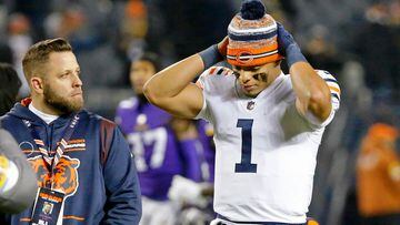 Dec 20, 2021; Chicago, Illinois, USA; Chicago Bears quarterback Justin Fields (1) reacts as he walks off the field after their loss to the Minnesota Vikings at Soldier Field. The Minnesota Vikings won 17-9. Mandatory Credit: Jon Durr-USA TODAY Sports