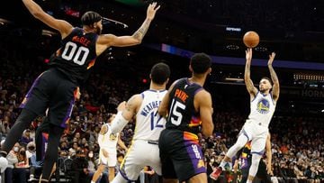 PHOENIX, ARIZONA - DECEMBER 25: Chris Chiozza #2 of the Golden State Warriors attempts a shot against the Phoenix Suns during the first half of NBA game at Footprint Center on December 25, 2021 in Phoenix, Arizona. NOTE TO USER: User expressly acknowledge