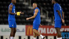 France's forward Kylian Mbappe (C) jokes next to France's midfielder Aurelien Tchouameni (L) and France's defender Axel Disasi (R) during a training session at Jassim-bin-Hamad Stadium in Doha on November 28, 2022, during the Qatar 2022 World Cup football tournament. (Photo by FRANCK FIFE / AFP) (Photo by FRANCK FIFE/AFP via Getty Images)