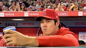 (FILES) Shohei Ohtani sits on the bench in the fourth inning during a game