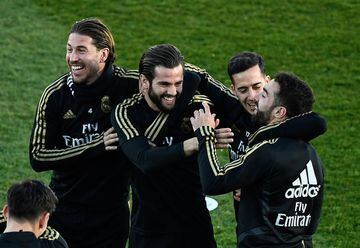 (L to R) Real Madrid's Spanish defender Sergio Ramos, Real Madrid's Spanish defender Nacho Fernandez, Real Madrid's Spanish forward Lucas Vazquez and Real Madrid's Spanish defender Dani Carvajal attend a public training session at the Ciudad Real Madrid t
