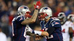 (FILES) This file photo taken on January 12, 2013 shows Aaron Hernandez #81 and Tom Brady #12 of the New England Patriots celebrating after a touchdown in the fourth quarter against the Houston Texans during the 2013 AFC Divisional Playoffs game at Gillette Stadium in Foxboro, Massachusetts.   Former American football star Aaron Hernandez on April 19, 2017 was found dead in prison where he was serving a life sentence for murder, after hanging himself with a bedsheet, prison officials said. Hernandez, 27, was discovered hanging in his cell by corrections officers in Shirley, Massachusetts at approximately 3:05 am (0705 GMT) Wednesday, Christopher Fallon with the Massachusetts Department of Correction said.&quot;Mr. Hernandez hanged himself utilizing a bedsheet that he attached to his cell window,&quot; Fallon&#039;s statement said.  / AFP PHOTO / GETTY IMAGES NORTH AMERICA / ELSA