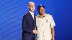 NEW YORK, NEW YORK - JUNE 23: NBA commissioner Adam Silver (L) and Kylian Mbappe pose for photos on the stage during the 2022 NBA Draft at Barclays Center on June 23, 2022 in New York City. NOTE TO USER: User expressly acknowledges and agrees that, by downloading and or using this photograph, User is consenting to the terms and conditions of the Getty Images License Agreement. (Photo by Arturo Holmes/Getty Images)