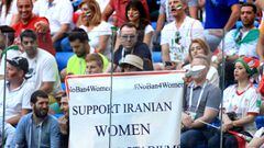 SAINT PETERSBURG, RUSSIA - JUNE 15: A woman holds up a large banner reading Support Iranian Women To Attend Stadiums, #NoBan4Women during the 2018 FIFA World Cup Russia group B match between Morocco and Iran at Saint Petersburg Stadium on June 15, 2018 in